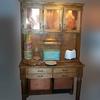 A hand crafted "Hoosier cabinet" with punched copper doors and copper bins. I even added a modest modern touch -- the hidden lights shining down on the tins and pins. 