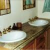 The owner of this concrete countertop was the inspiration for this design. This is a hybrid of cast in mold and cast in place. The top and front are hand formed while the sides back and sink knock out's are cast in a form.