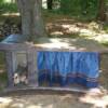 An outdoor counter with built in charcoal/wood grill.