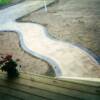 A curved sidewalk leading from that same driveway.