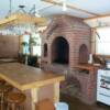 This is an indoor wood fired BBQ. Take note of the hand made cedar stemware rack and the island that was fashoined out of an old bowling alley.