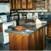 But it does get better. Notice we used the same cabinets and simply added a few new cabinets, such as the island and the glassware shelves
