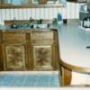 Notice the bent wood edges on the countertop and the four way book match doors on the sink base. These are also custom cabinets and they do show up in that gallery as well. This was the first time we remodeled that kitchen.
